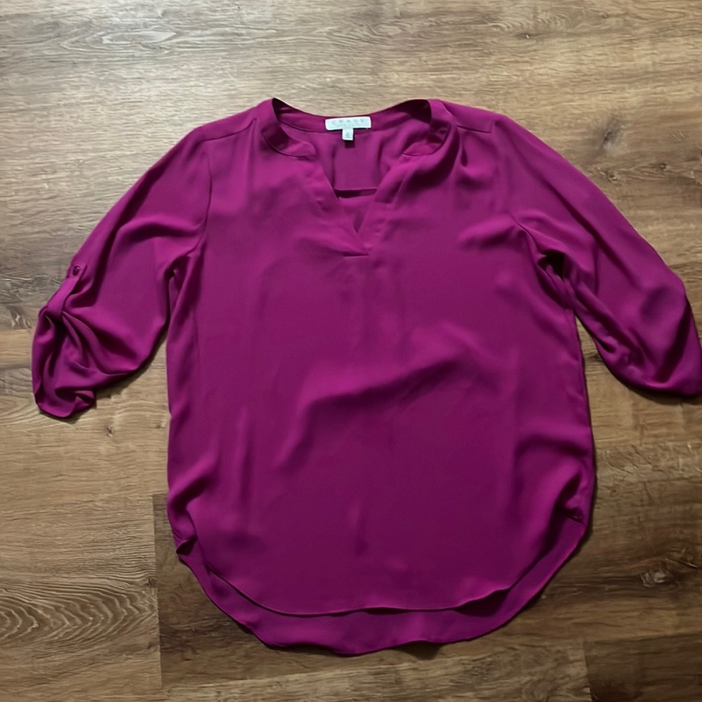 Flowy, bright purple blouse, high low hemline detail